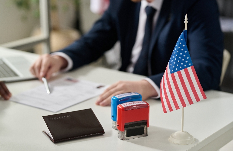 Approved and rejected stamps on table in US immigration office