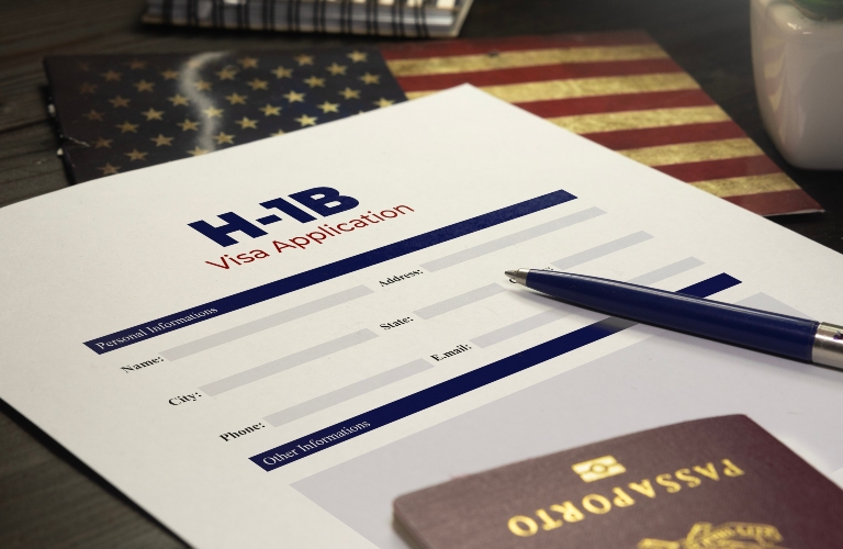 H-1b visa application concept_ USA H-1B visa application on a table with a passport